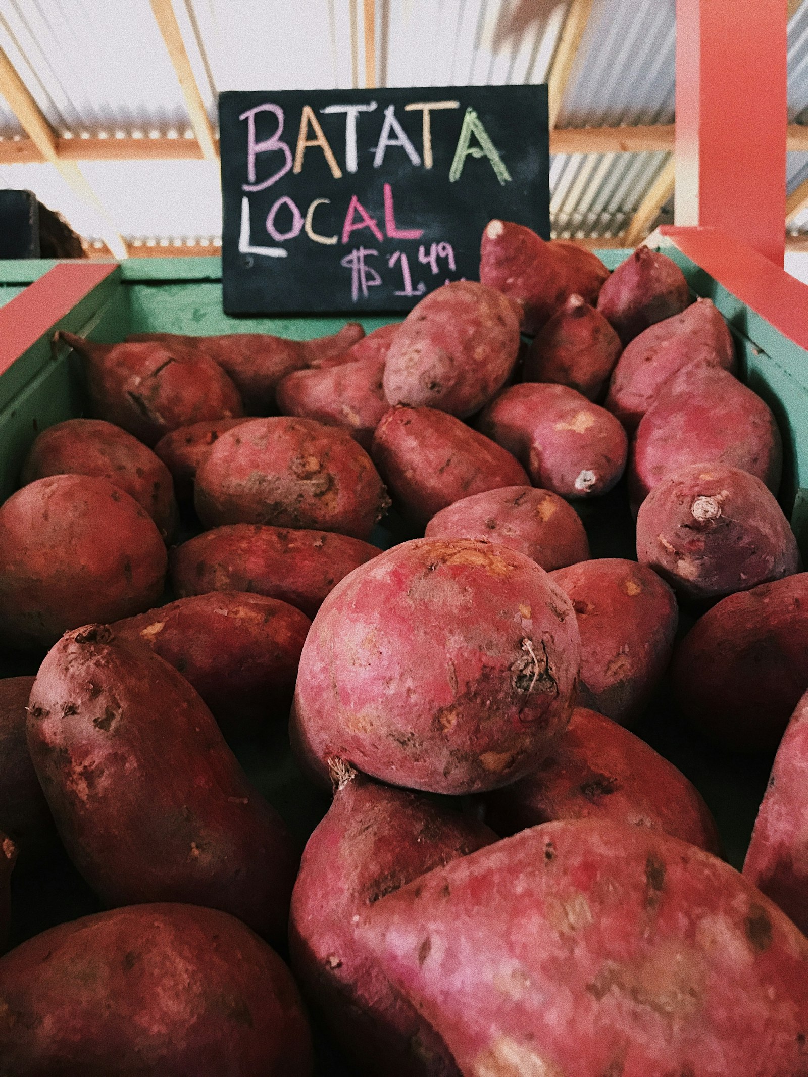 Roasted Korean sweet potato goguma on a wooden surface