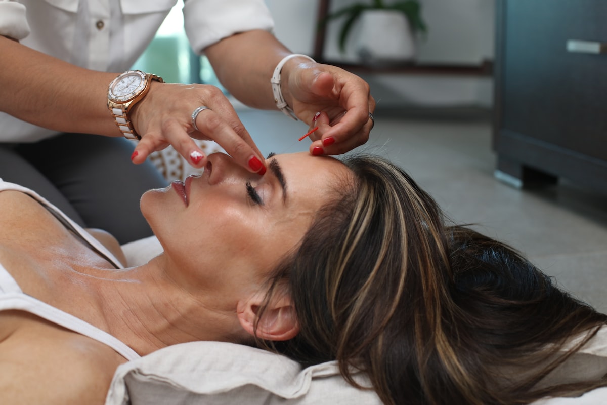 Woman resting with relaxed hands, representing a calming self-care ritual