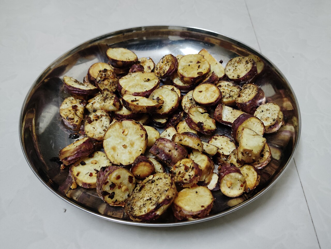 Roasted sweet potato halves showing orange flesh
