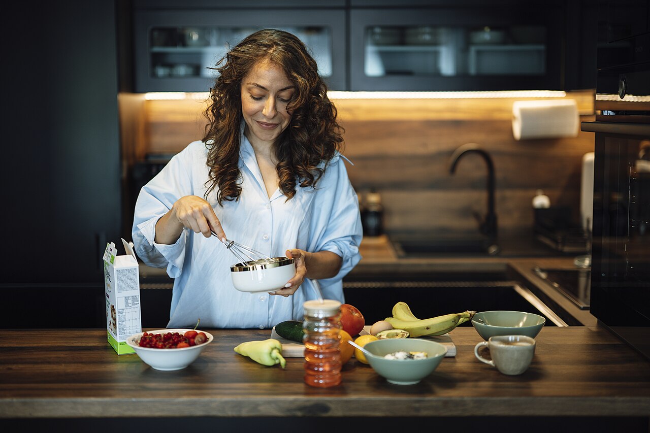 Woman preparing a healthy meal at home
